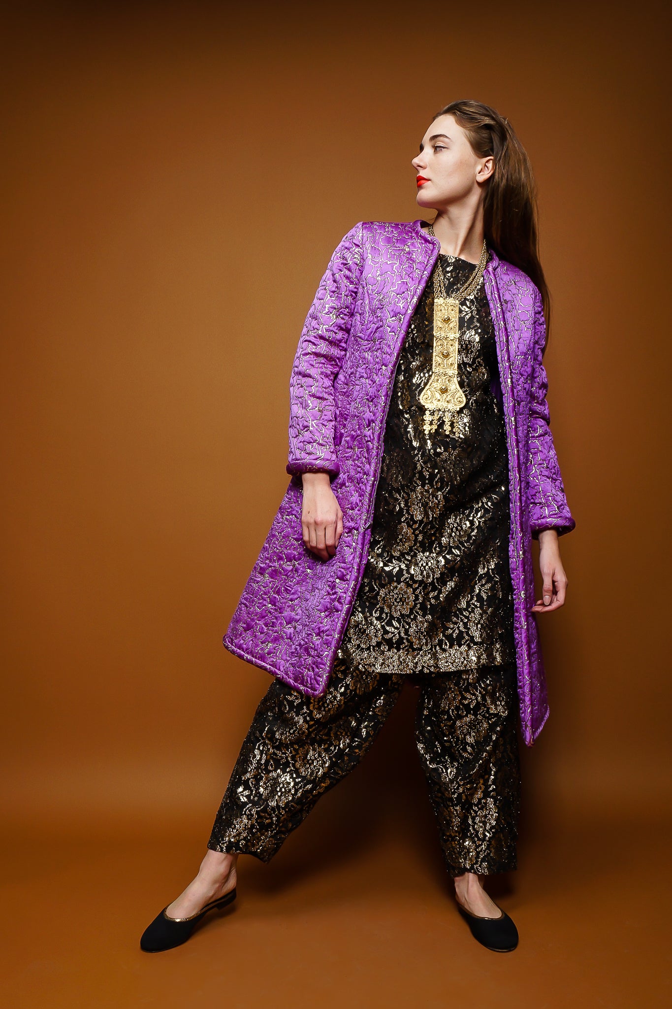 girl in Oscar de la Renta brocade coat & moroccan lace tunic & harem pant on brown @ Recess LA