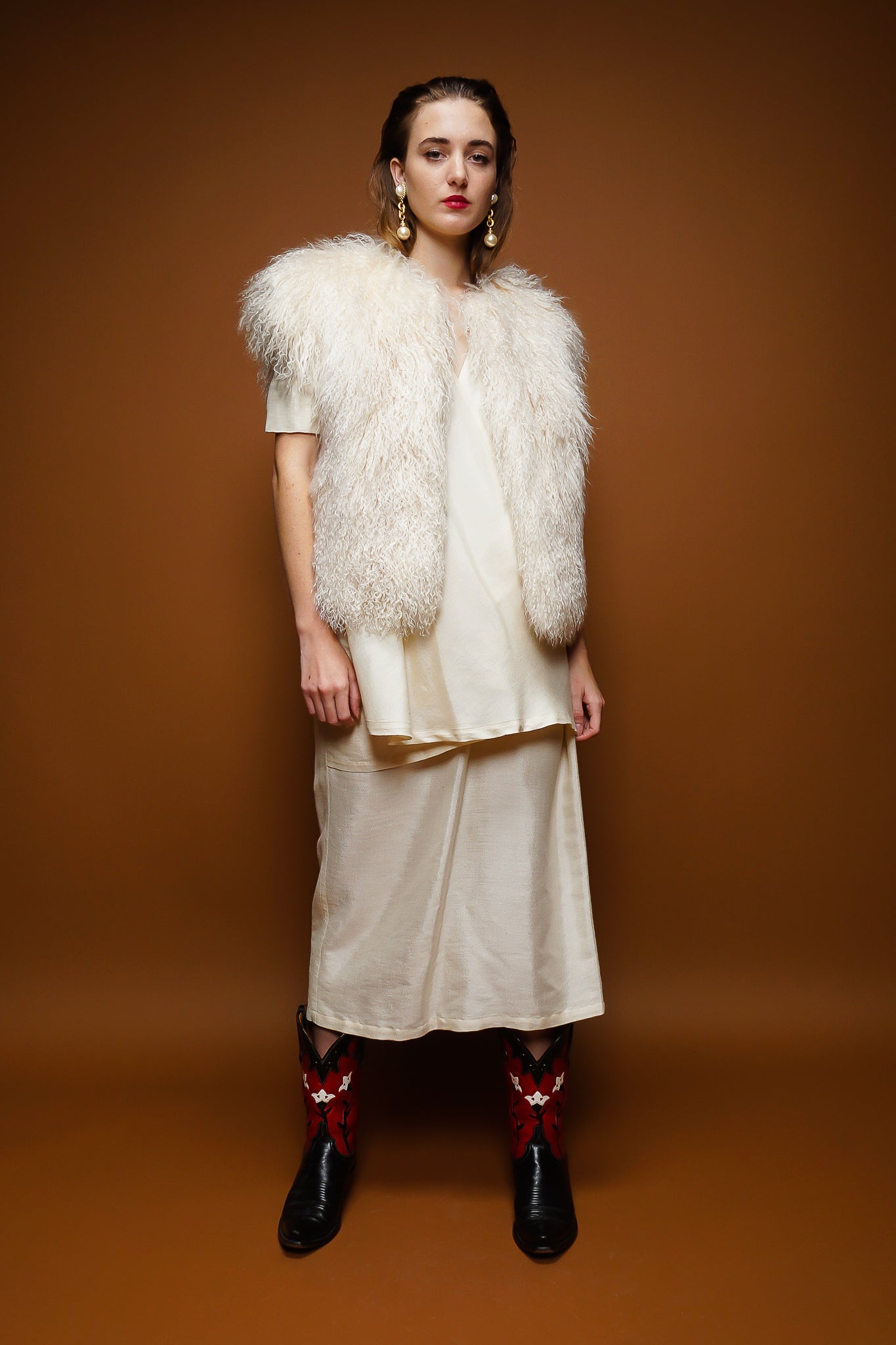 girl in Tony Lambert mongolian fur vest & Catherine Marlet dress on brown @ Recess Los Angeles