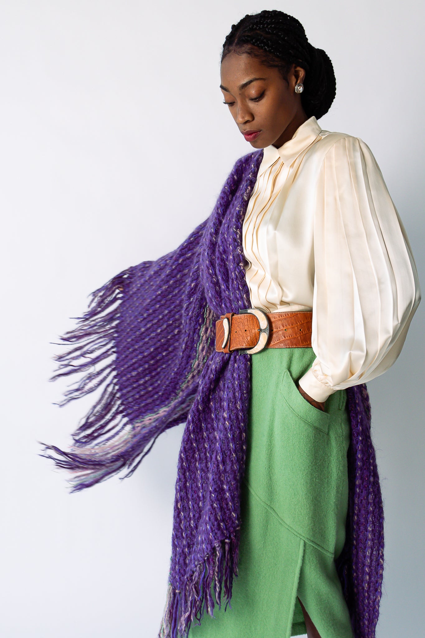 Girl wearing purple yarn shawl mint skirt and belt at Recess Los Angeles