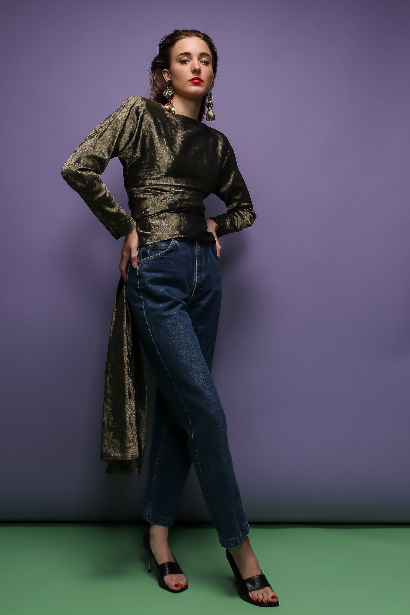 girl in sage silk Carolyne Roehm tie back top & jeans on purple at Recess Los Angeles