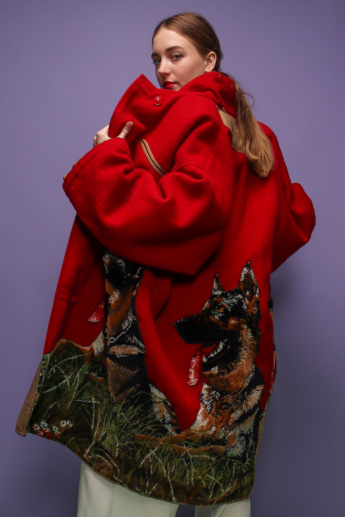 girl in red Jean Charles de Castelbajac coat w/ German Shepard design on purple at Recess LA