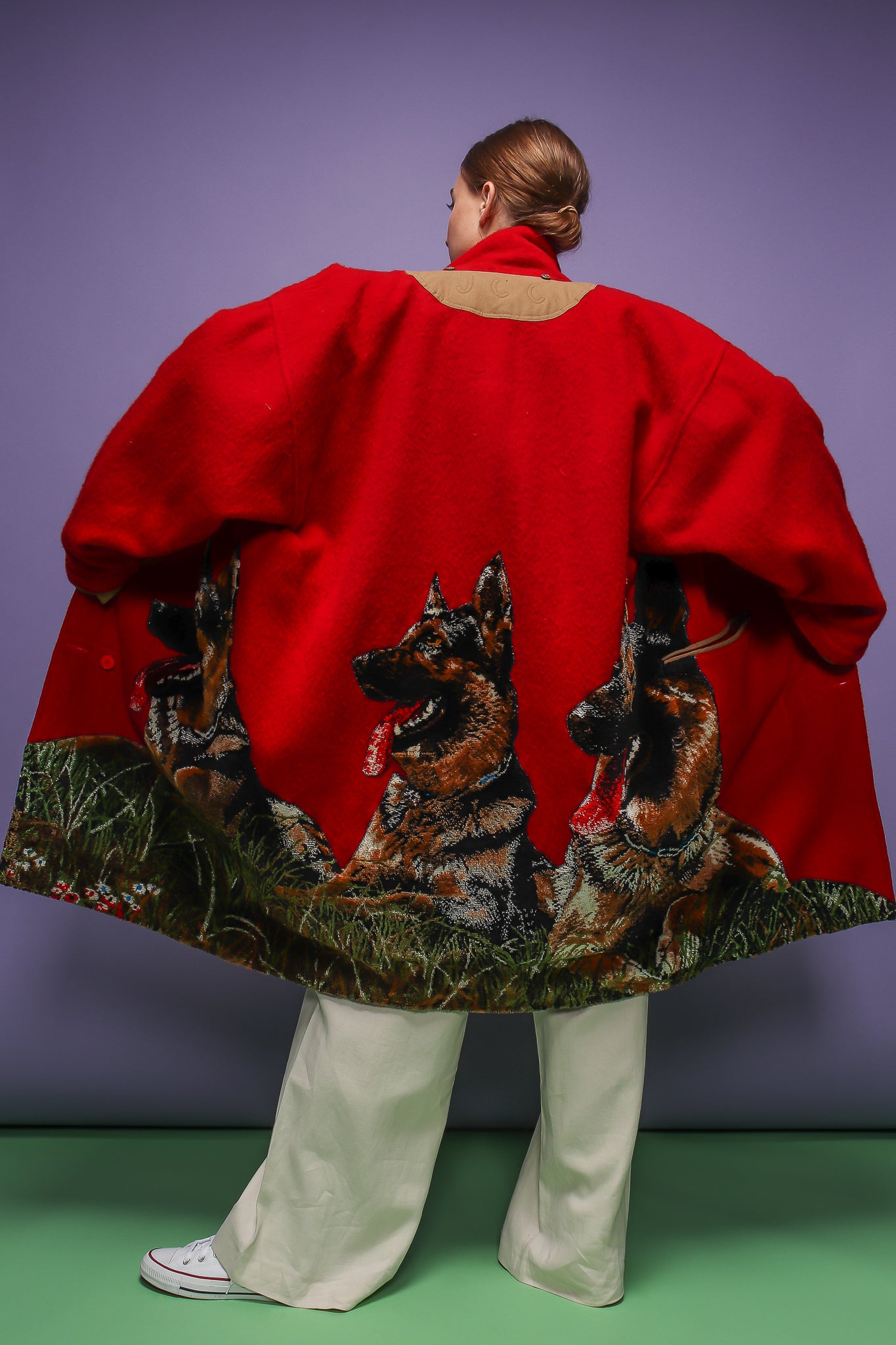 girl in red Jean Charles de Castelbajac coat w/ German Shepard design on purple at Recess LA