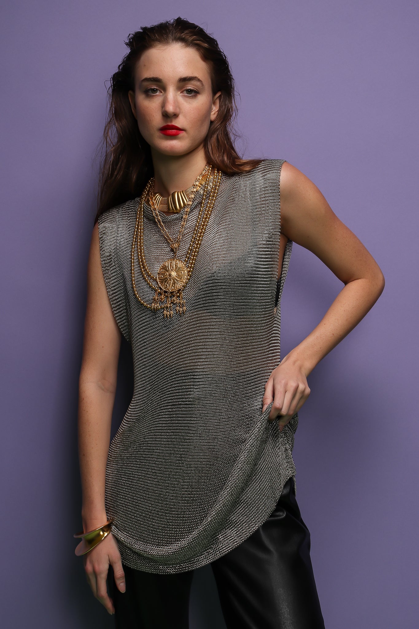 girl in silver metal mesh mini dress tunic and gold necklaces at Recess Los Angeles