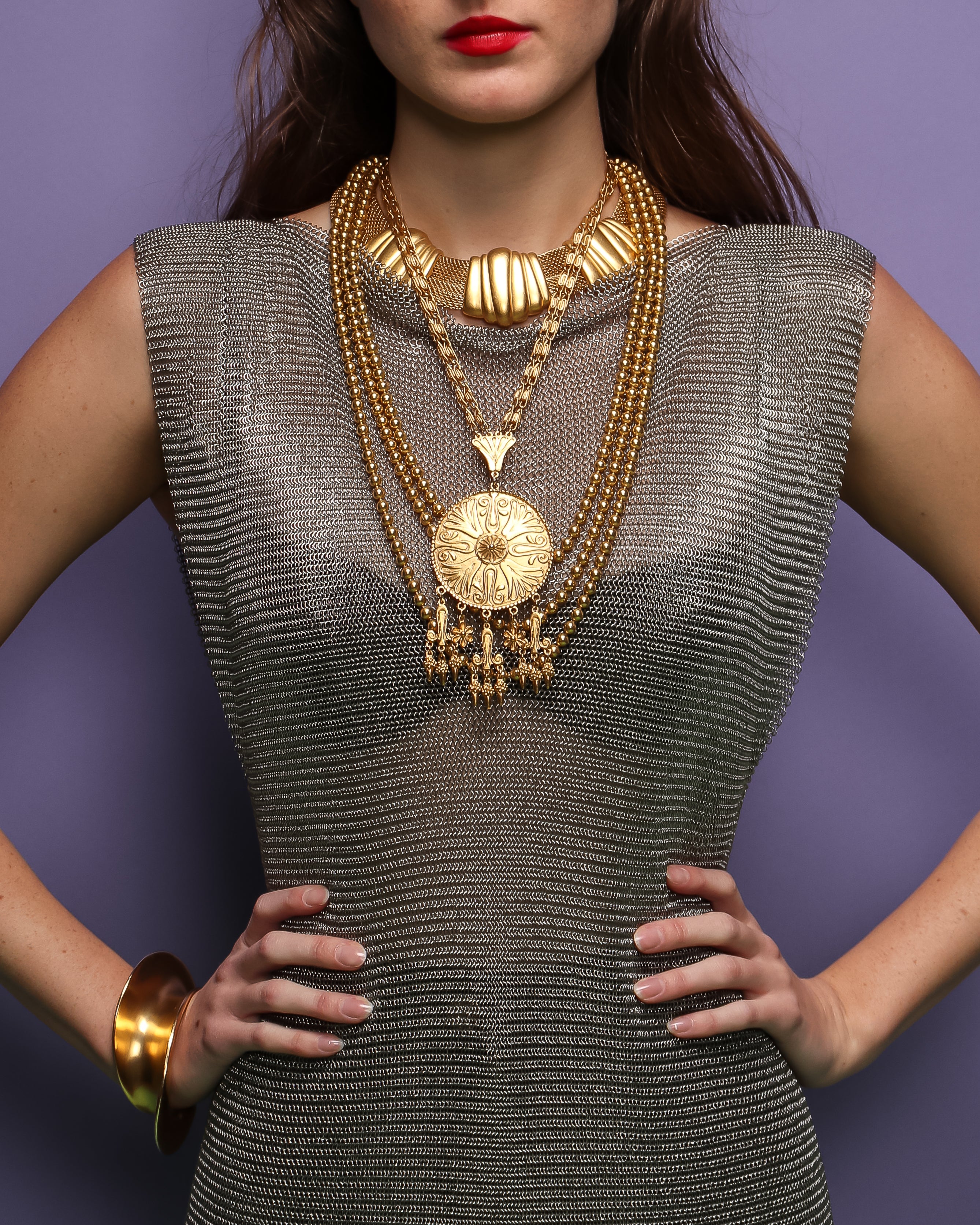girl in silver metal mesh mini dress tunic and gold necklaces at Recess Los Angeles