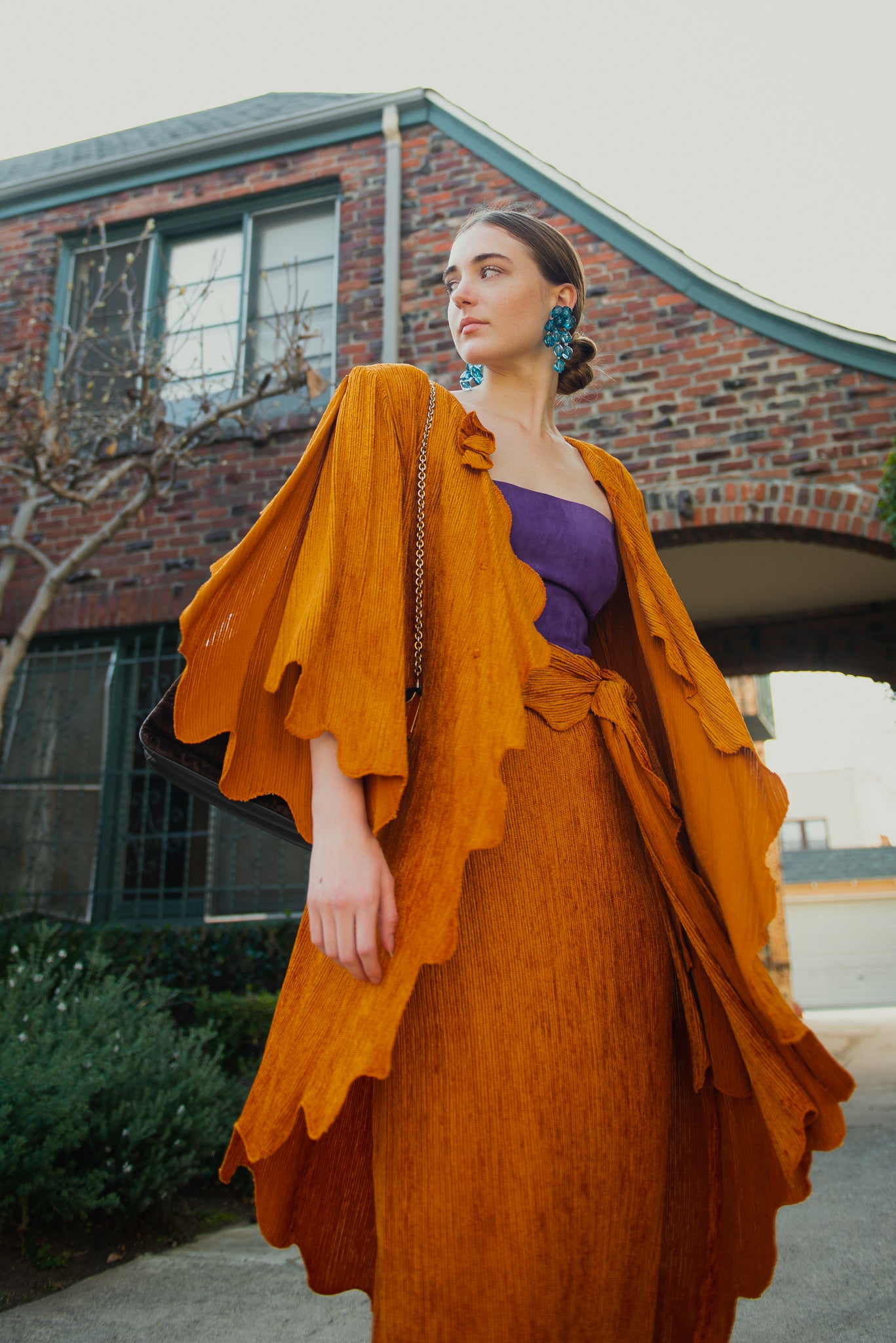 Girl in orange Vintage Holly’s Harp Jacket and Skirt Set from Recess Los Angeles