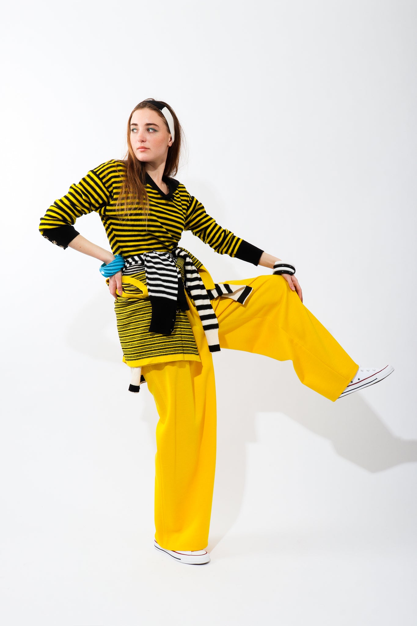 Recess Vintage Sonia Rykiel Rainbow Girl in yellow striped sweater and yellow pants on one leg