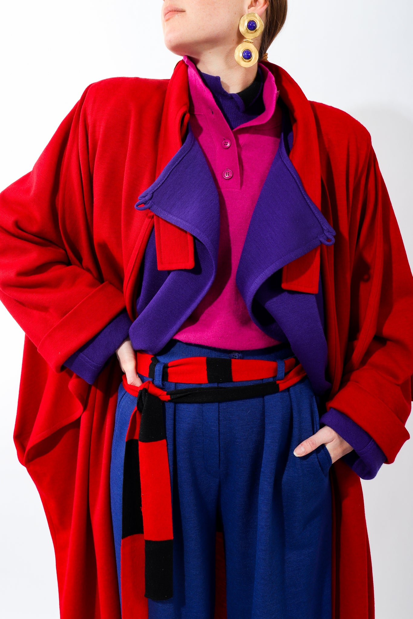 Girl in layers of purple red and pink Sonia Rykiel knit wool coats