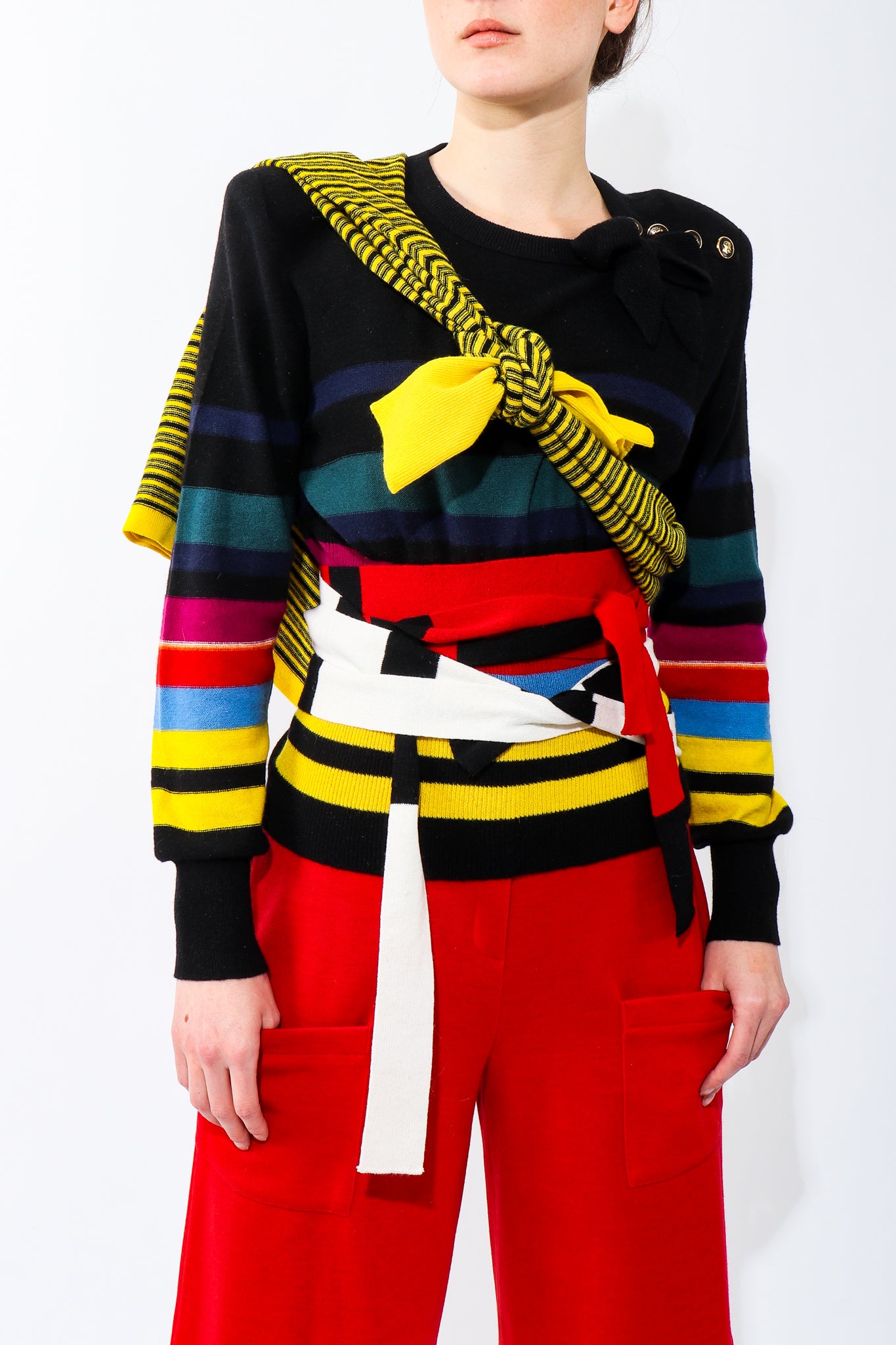 Recess Vintage Sonia Rykiel Rainbow Girl in red shorts & black sweater w/ belts & ties