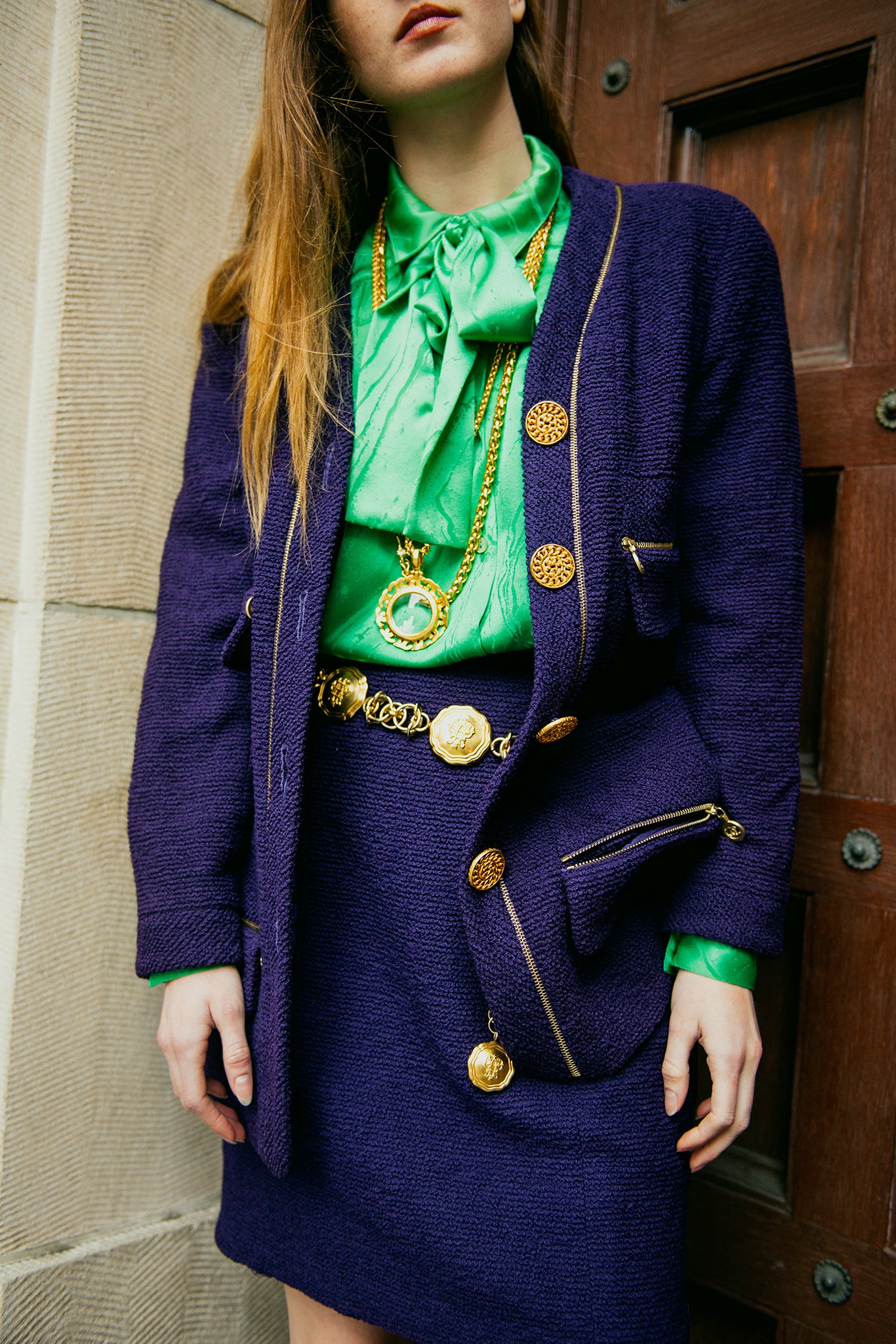 Recess girl in Vintage Chanel purple Boucle jacket and skirt with green blouse