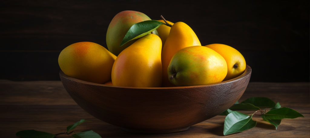 Bowl of ripe mangos long