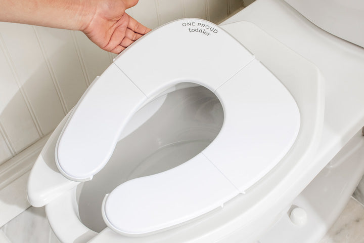 Deployed Potty Proud Seat with Hand Over Toilet