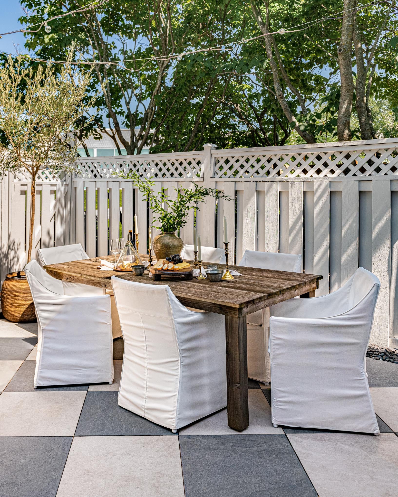 Custom wine trough in an outdoor dining table in West Of Main's backyard oasis.