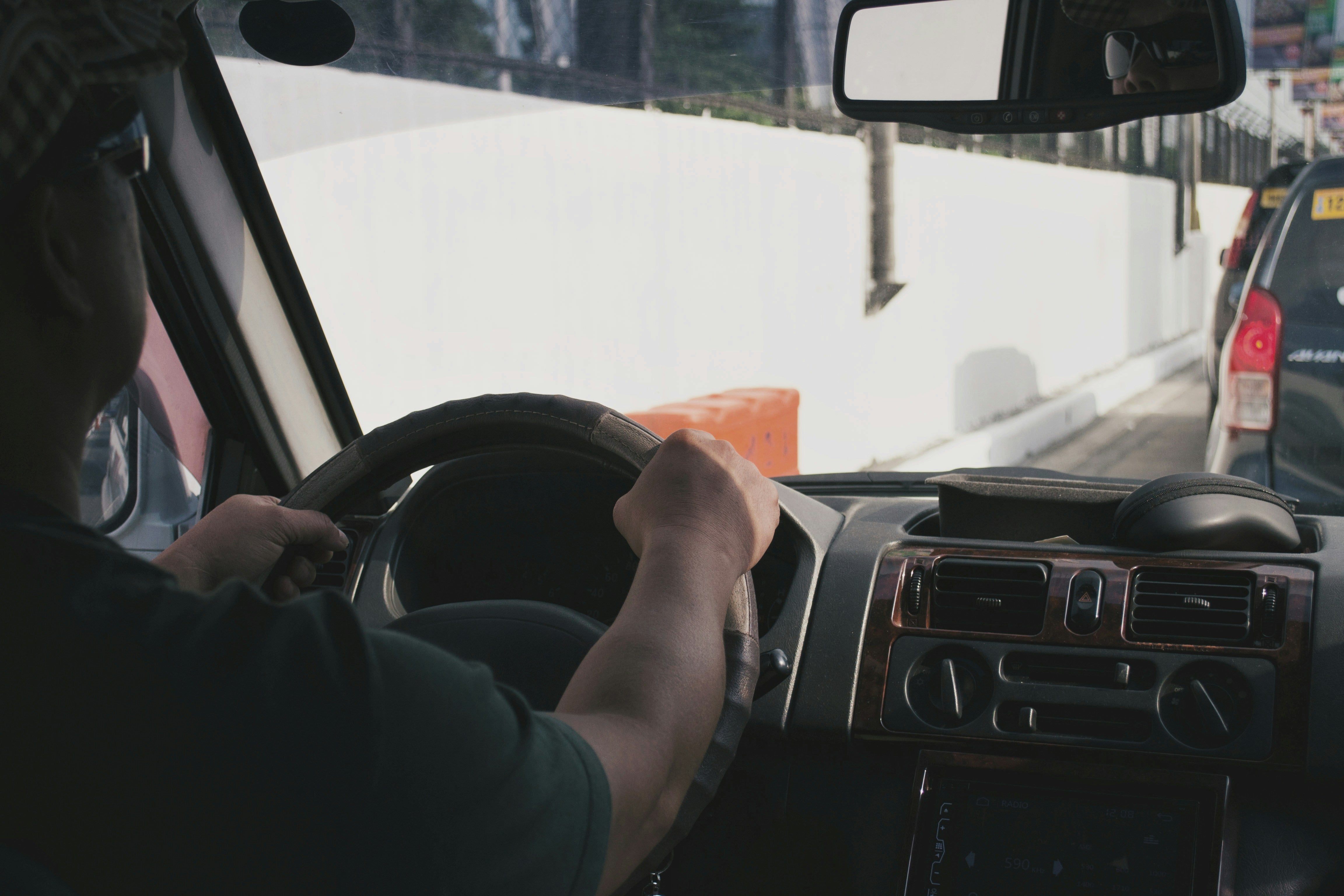 Proud trucker admiring his pristine truck bed with SMARTLINER protection