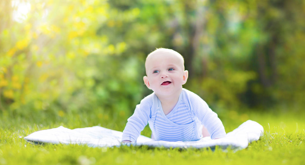 Baby outside on grass