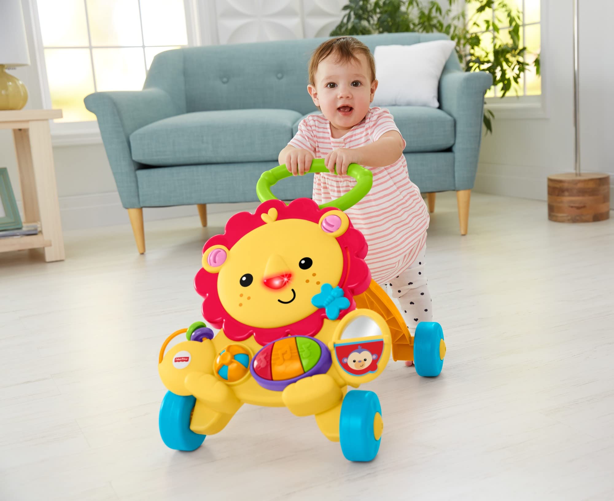 ALT Text: Baby girl pushing toy walker