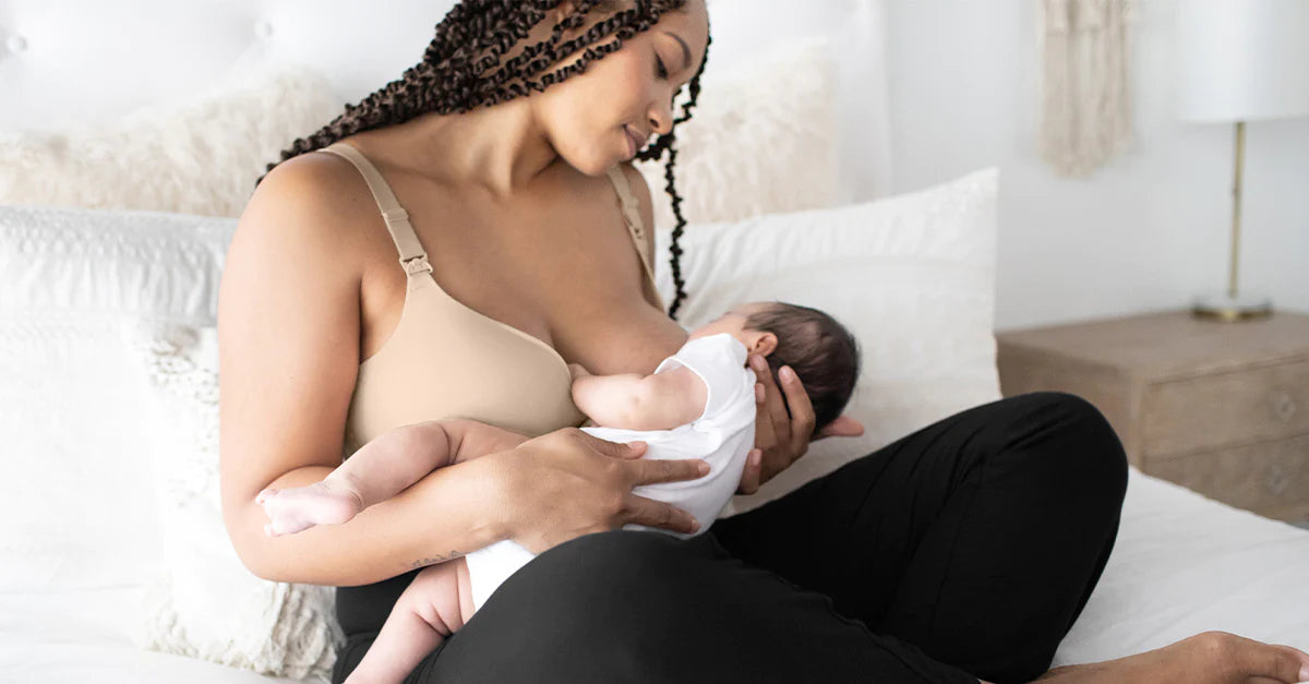 woman using a nursing bra to breastfeed