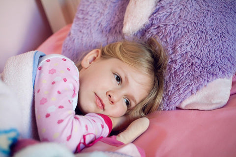 Child laying in bed