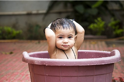 baby in a tub of water