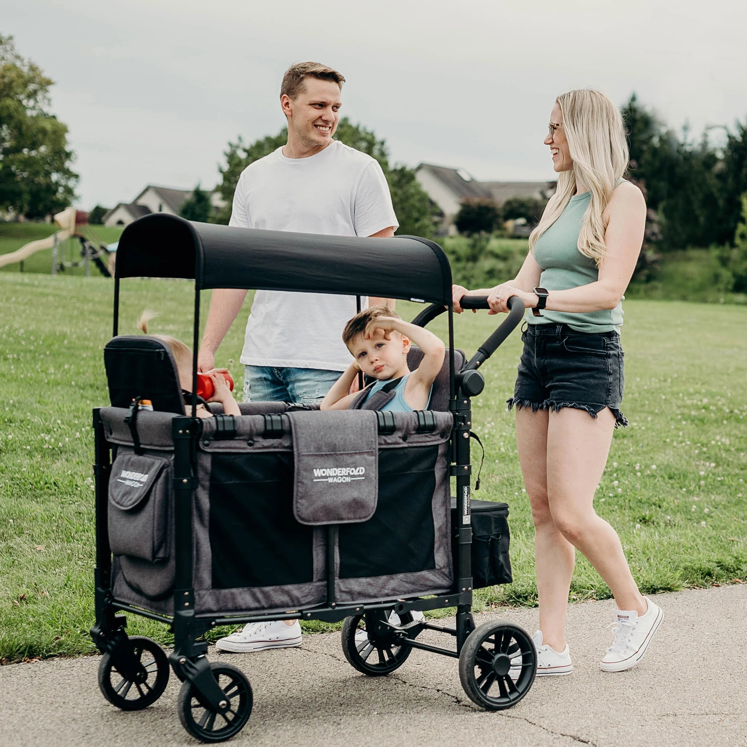 Family strolling with wagon