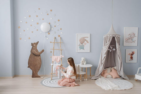 woman decorating nursery