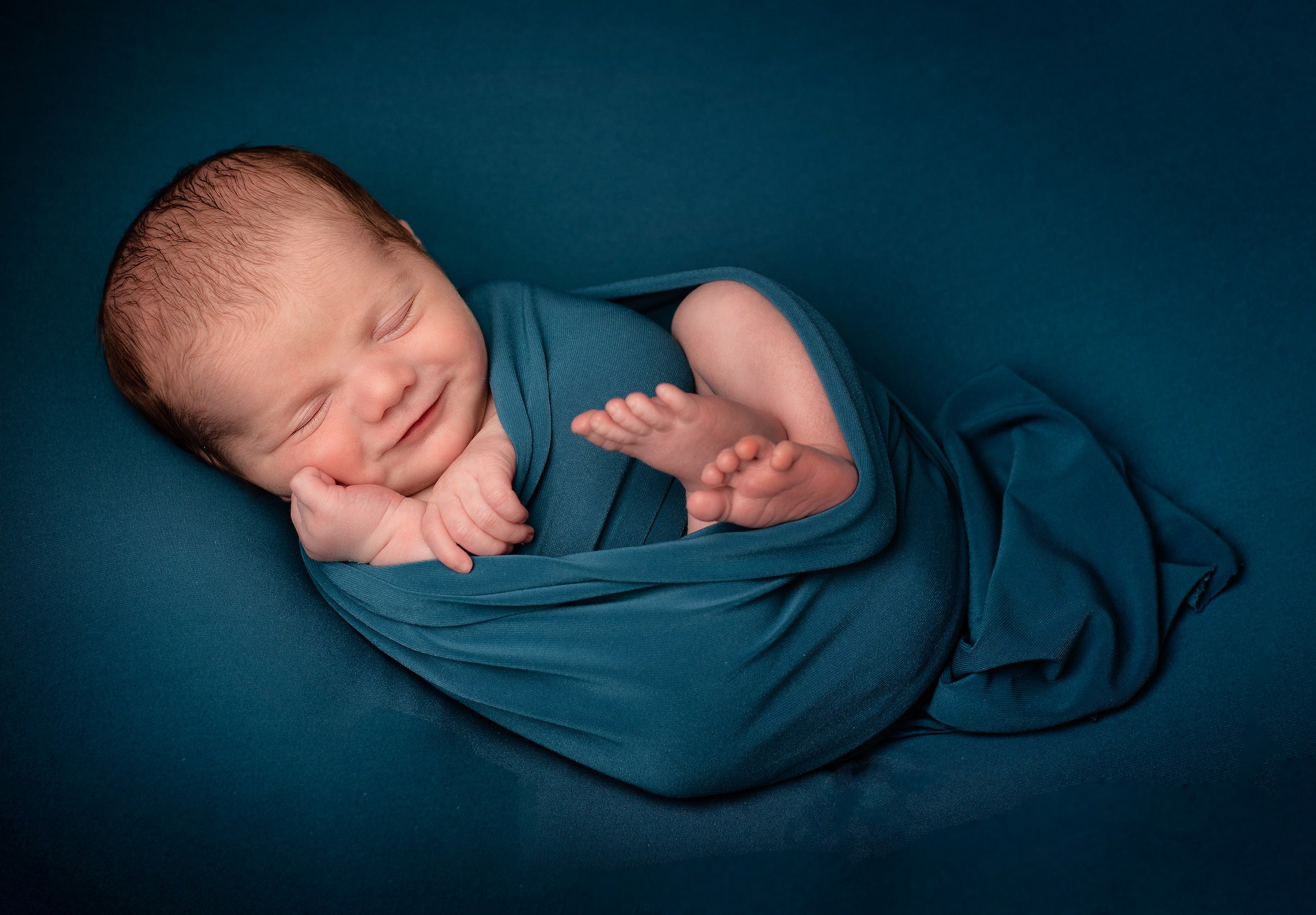a baby in a wearable blanket