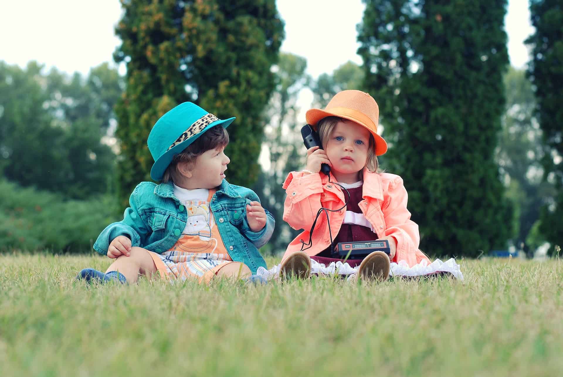 two babies sitting together