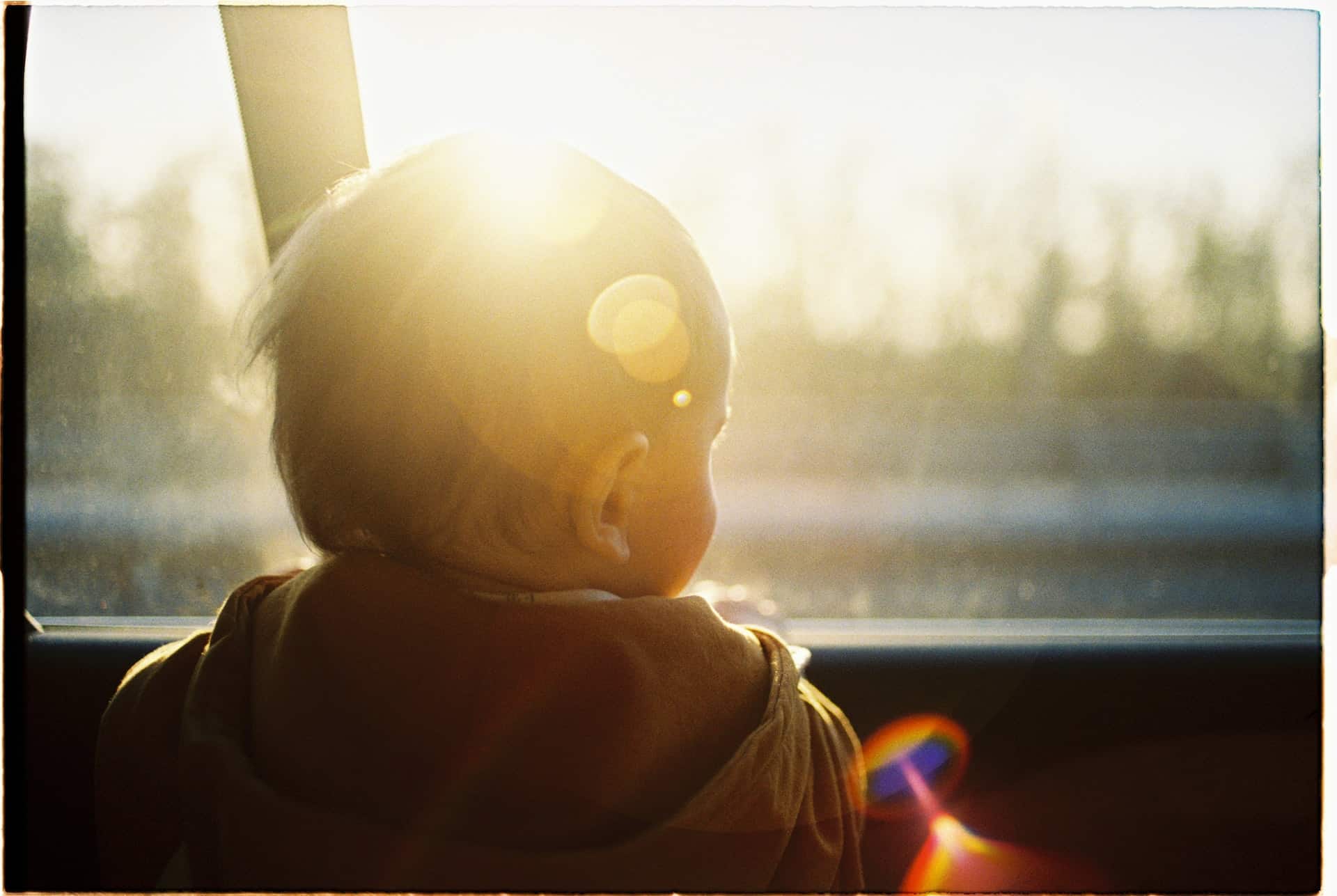 Baby in car with sunlight