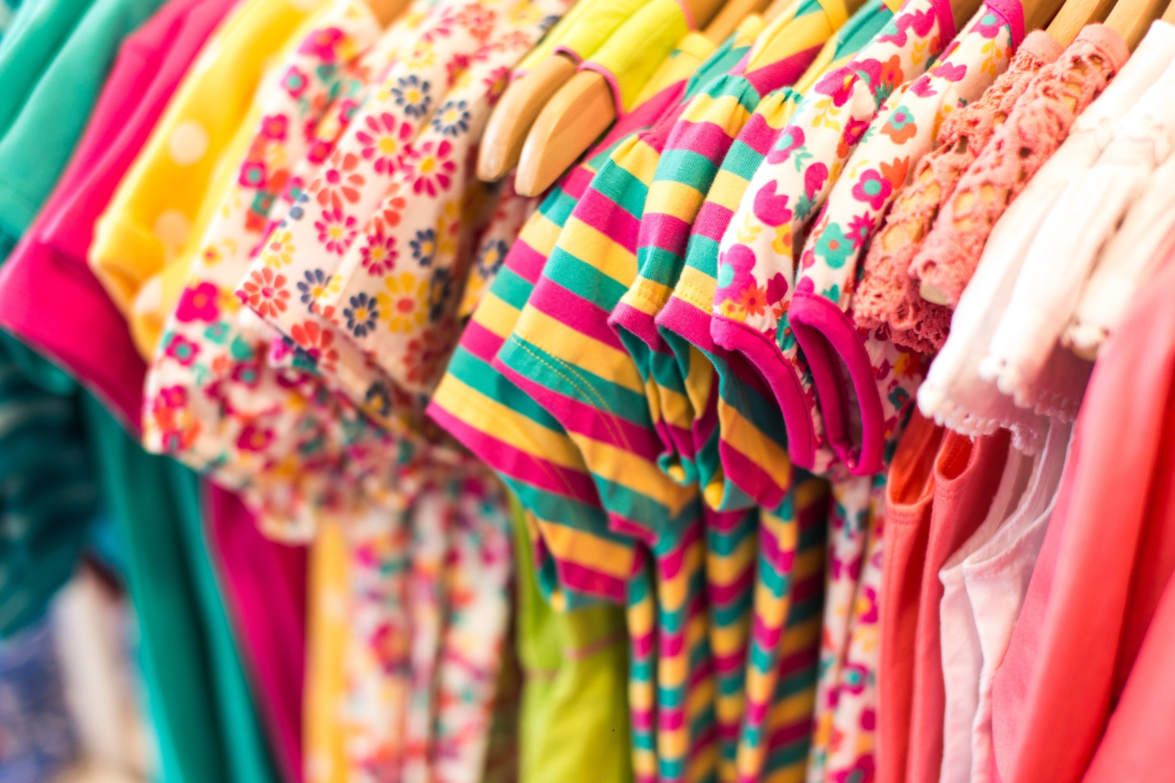colorful baby clothing on a rack