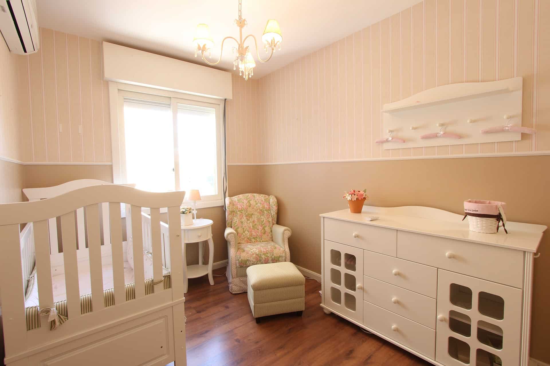 Pink nursery with crib and changing station