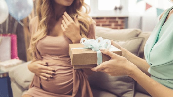 Pregnant woman getting gift