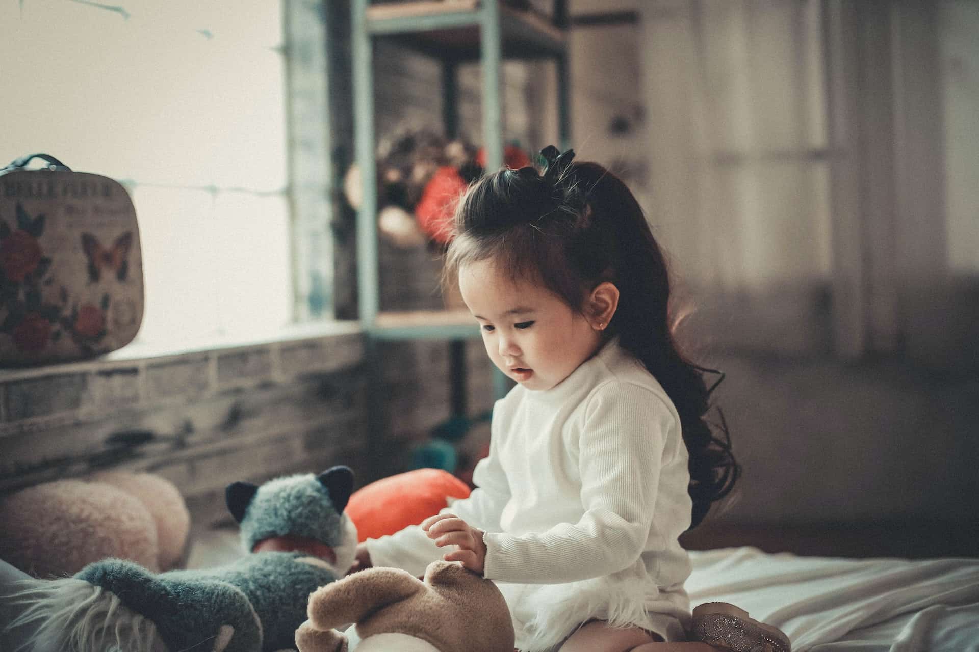 Baby Playing With Stuffed Animals