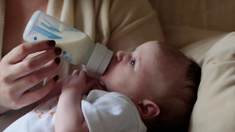 Baby drinking from bottle