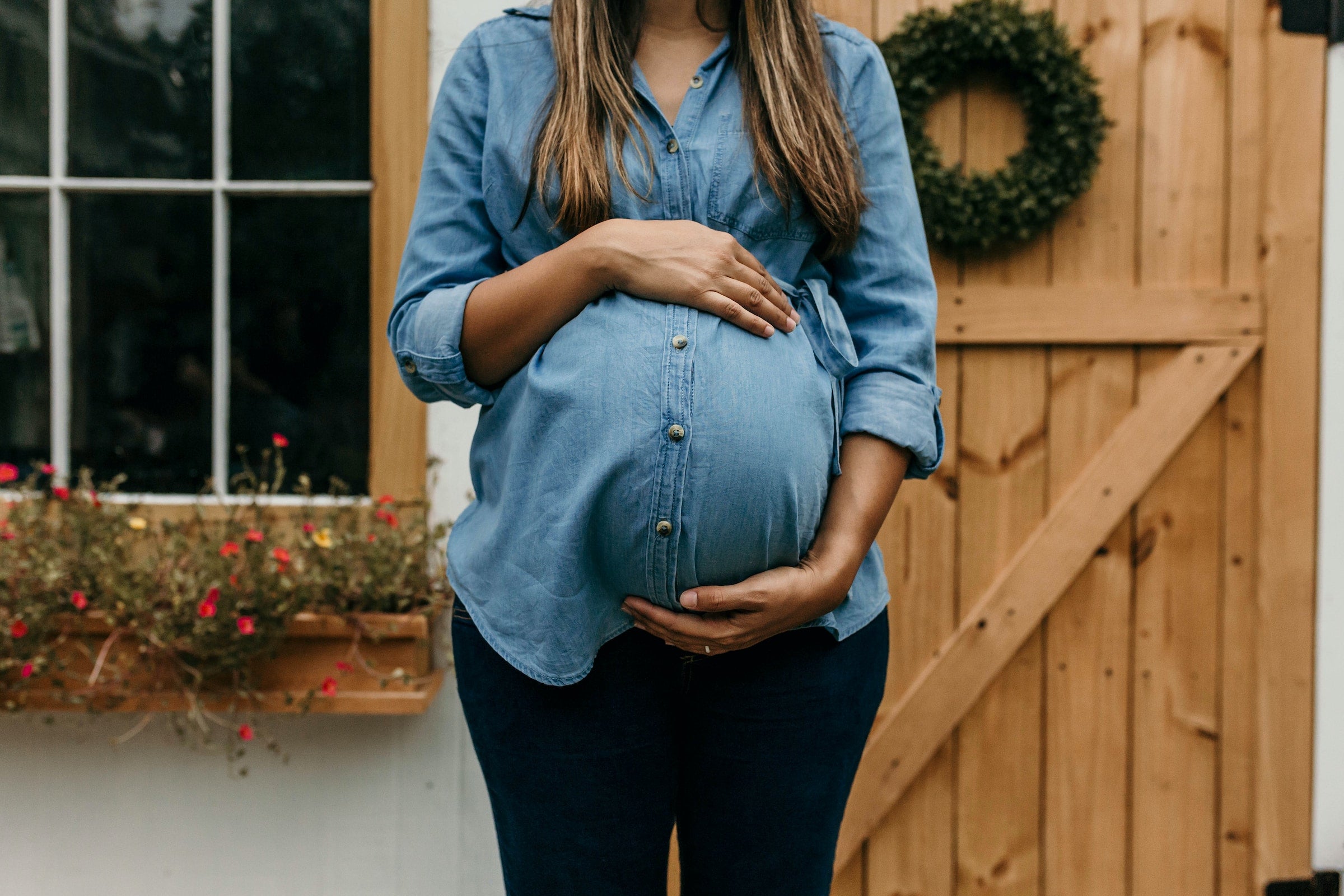 Pregnant woman holding belly