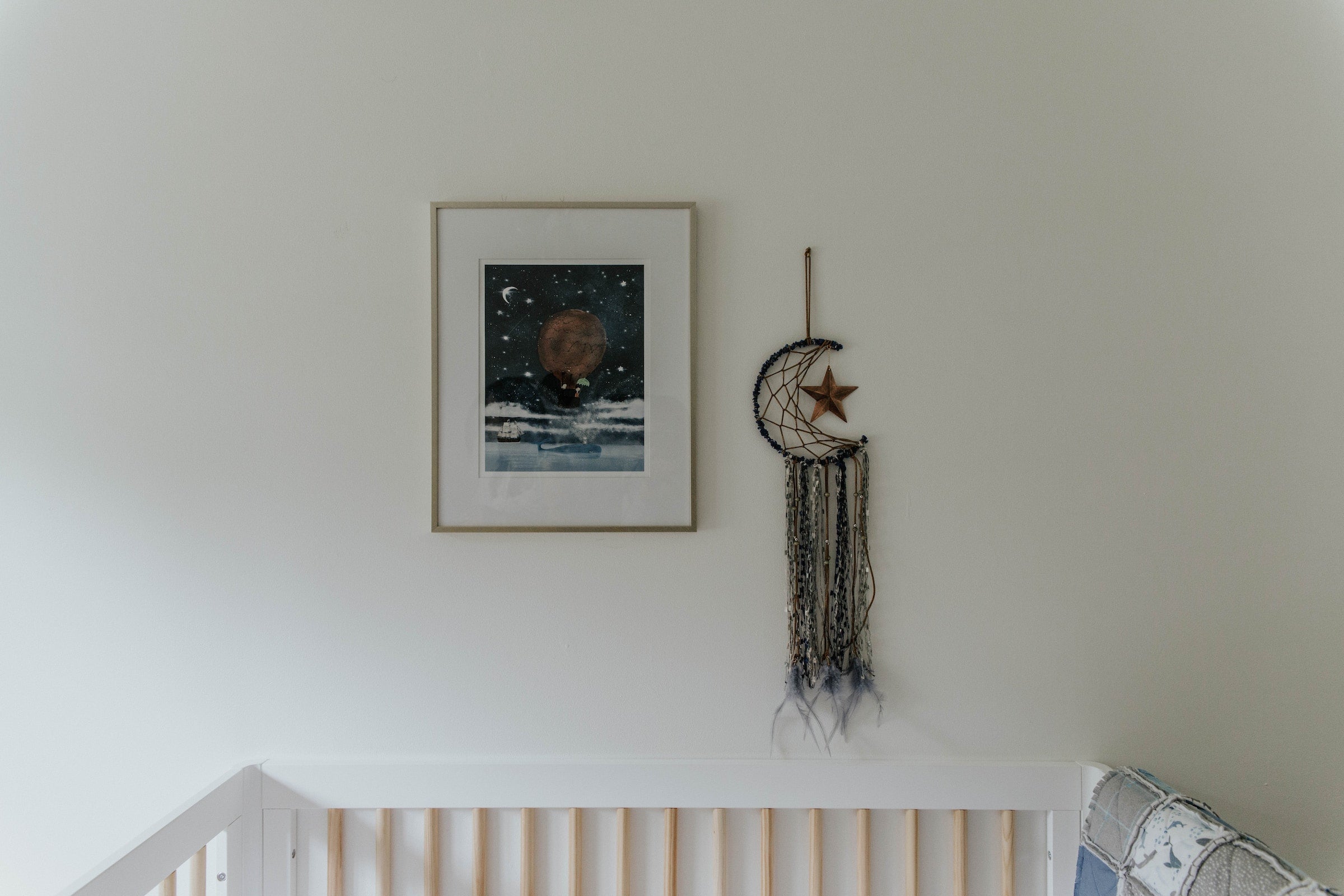 dreamcatcher and photo of space in a nursery