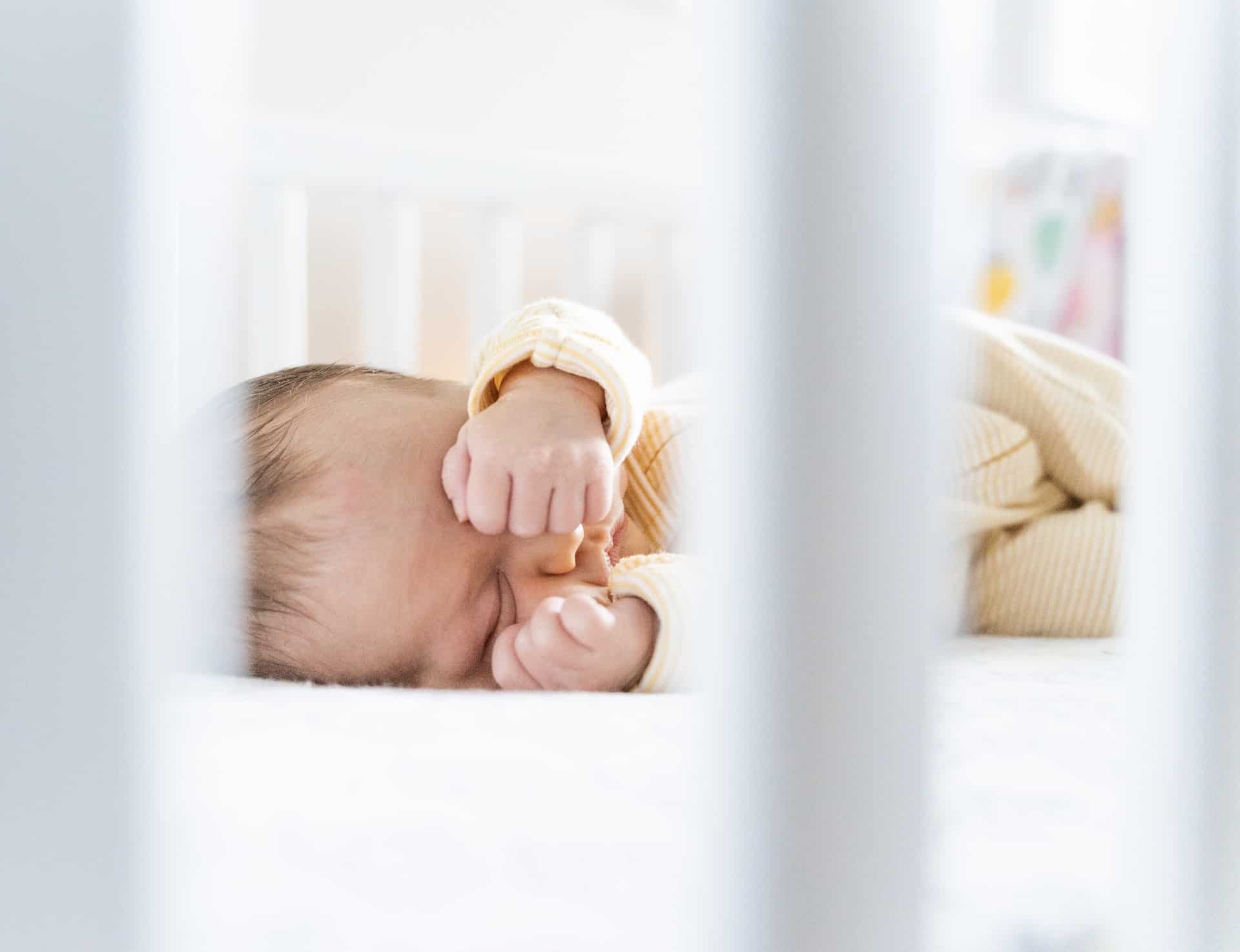 baby lying in a crib