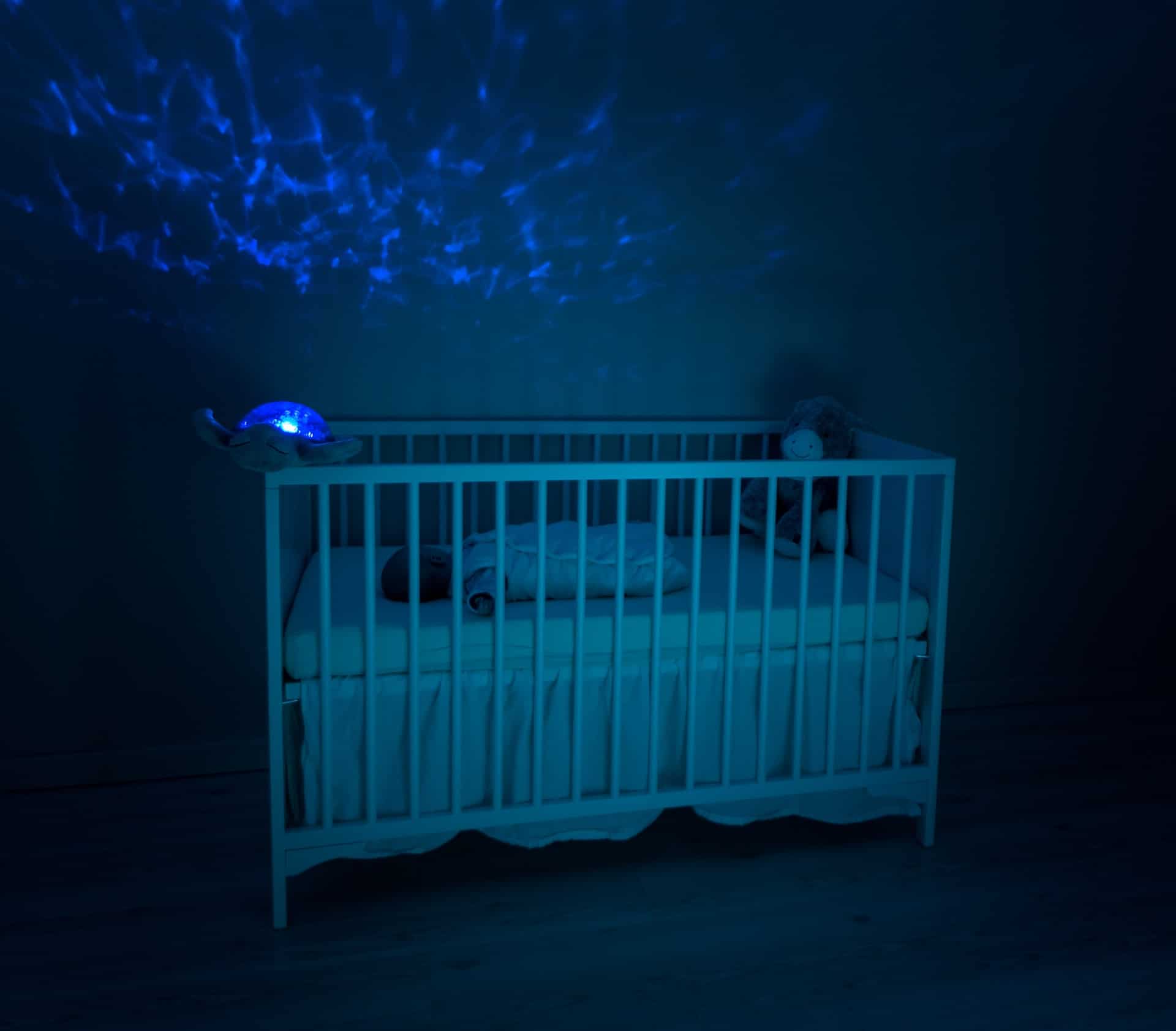 baby sleeping in dark room
