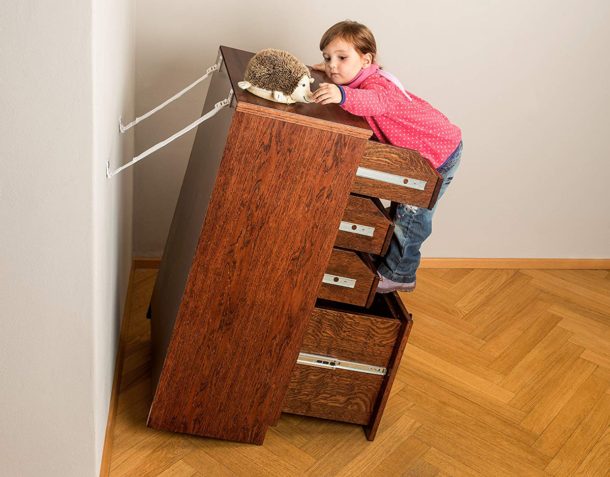 Girl tipping furniture