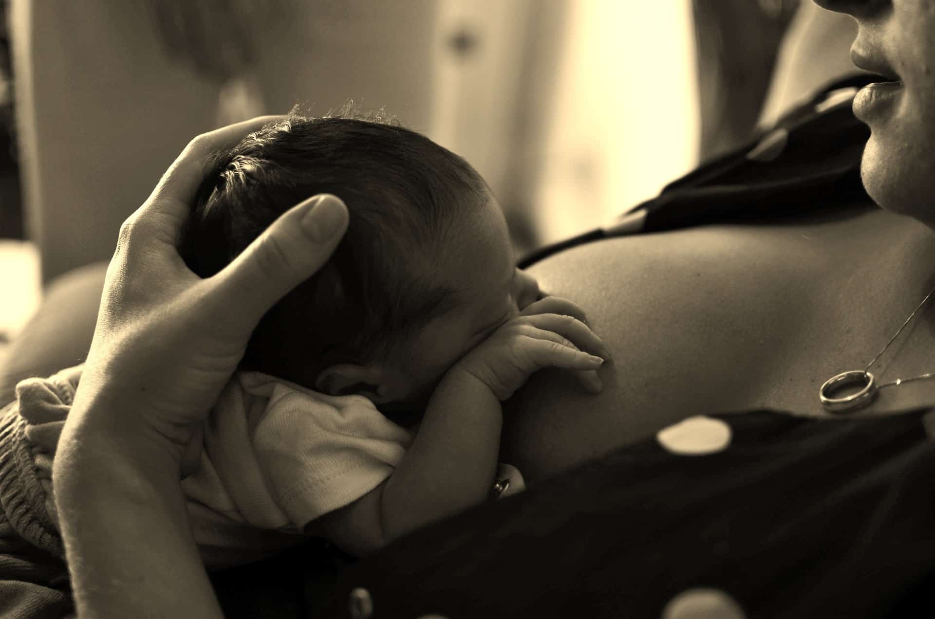 A baby breastfeeding.