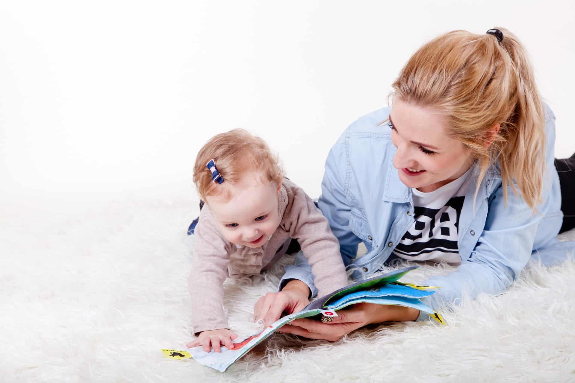 Mom and Baby Reading on Carpet