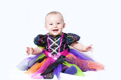 Cute baby dressed in Halloween costume.