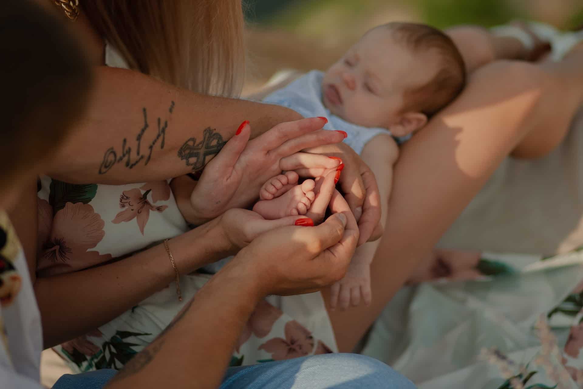 parent holding their baby in their lap