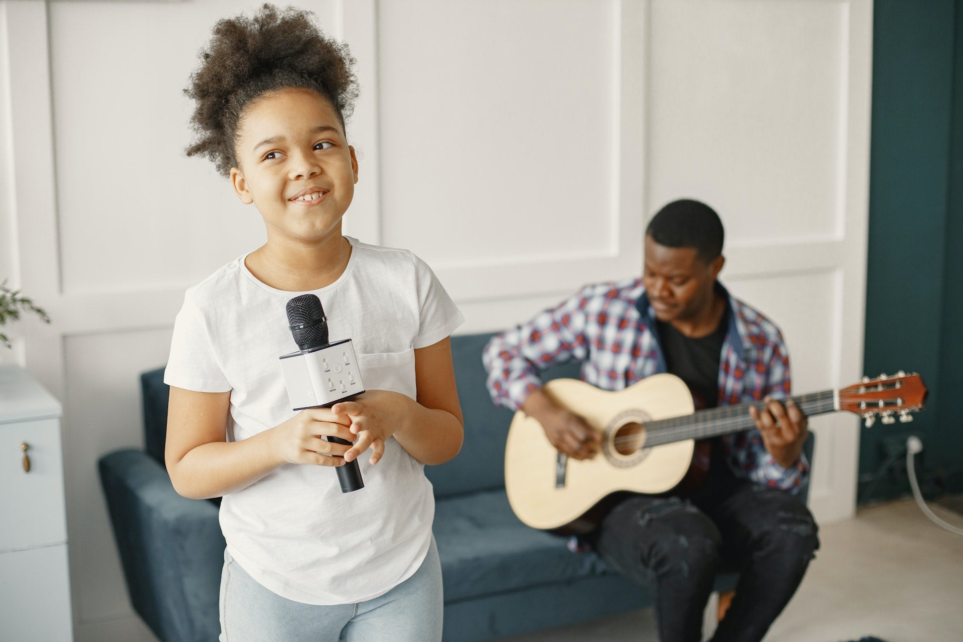 Dad playing music with daughter