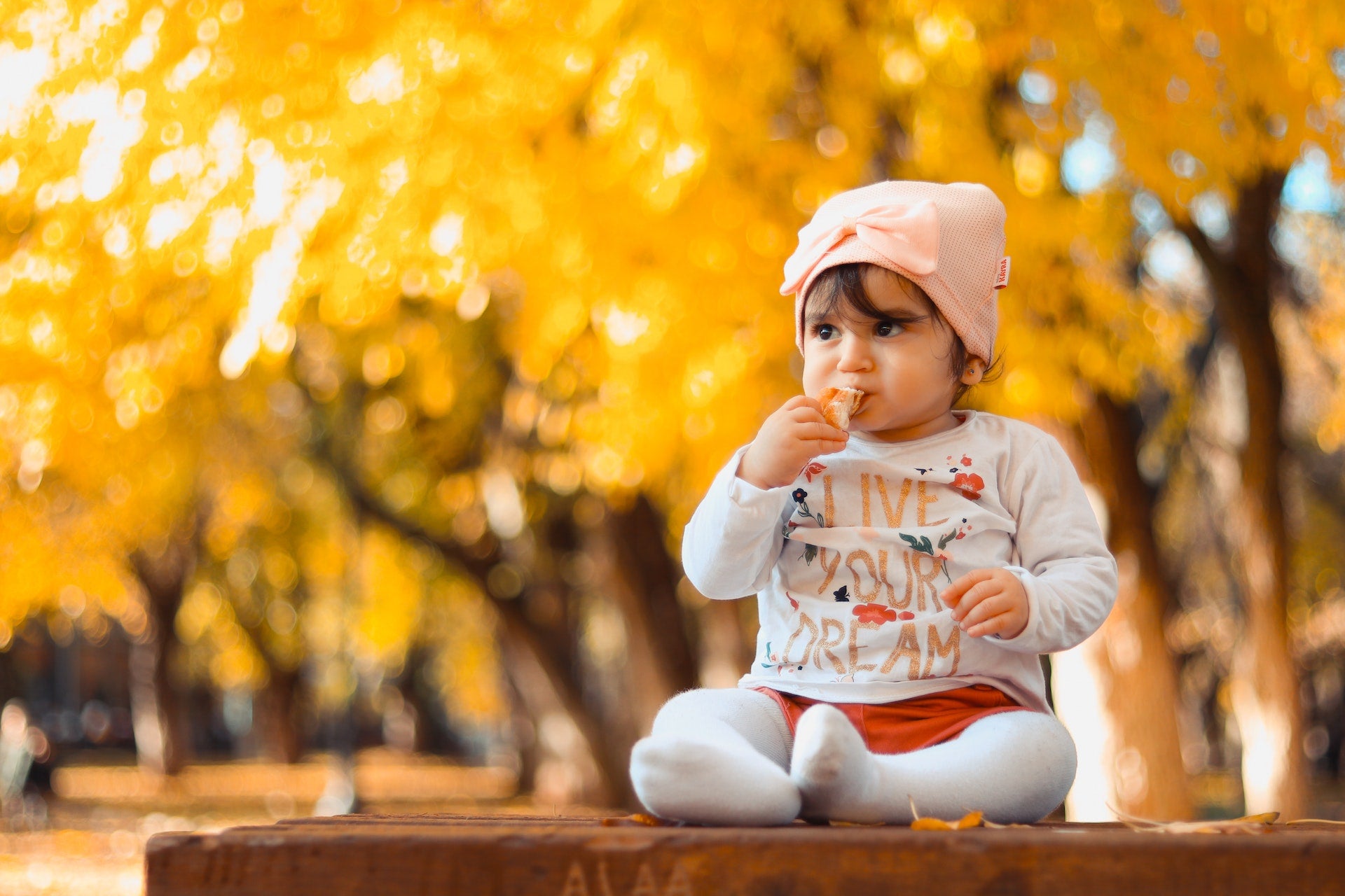 a baby eating outside