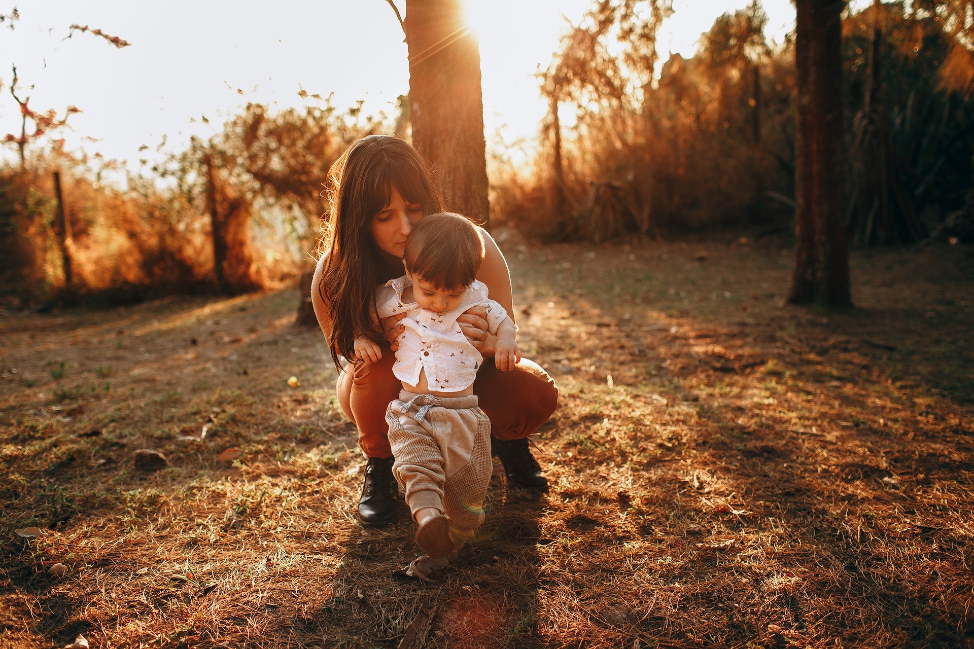 a mother walking her baby outside