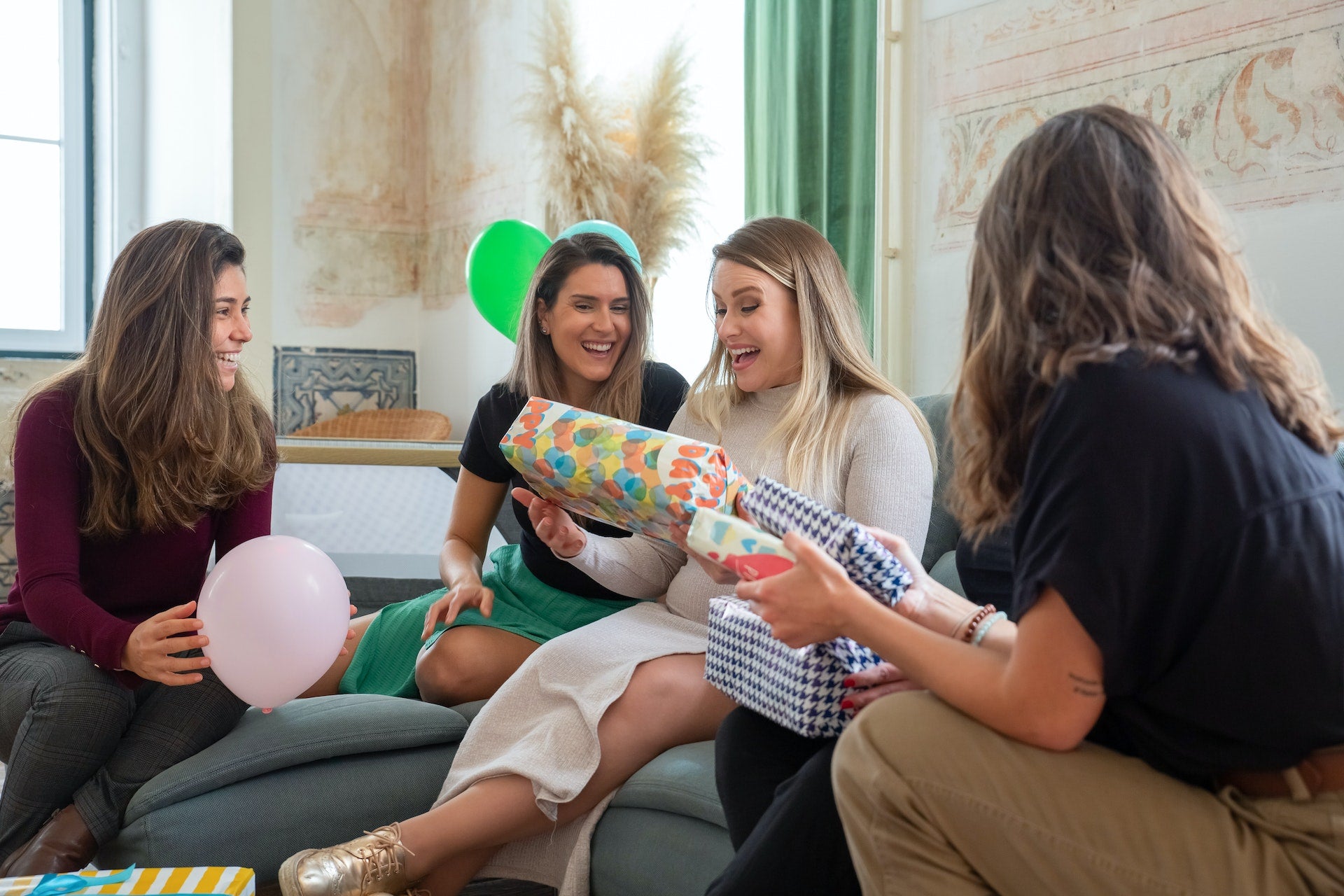 women laughing at a diaper raffle