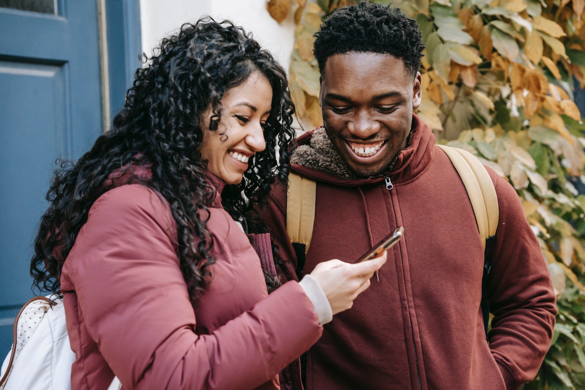 smiling couple watching their baby on a baby monitor