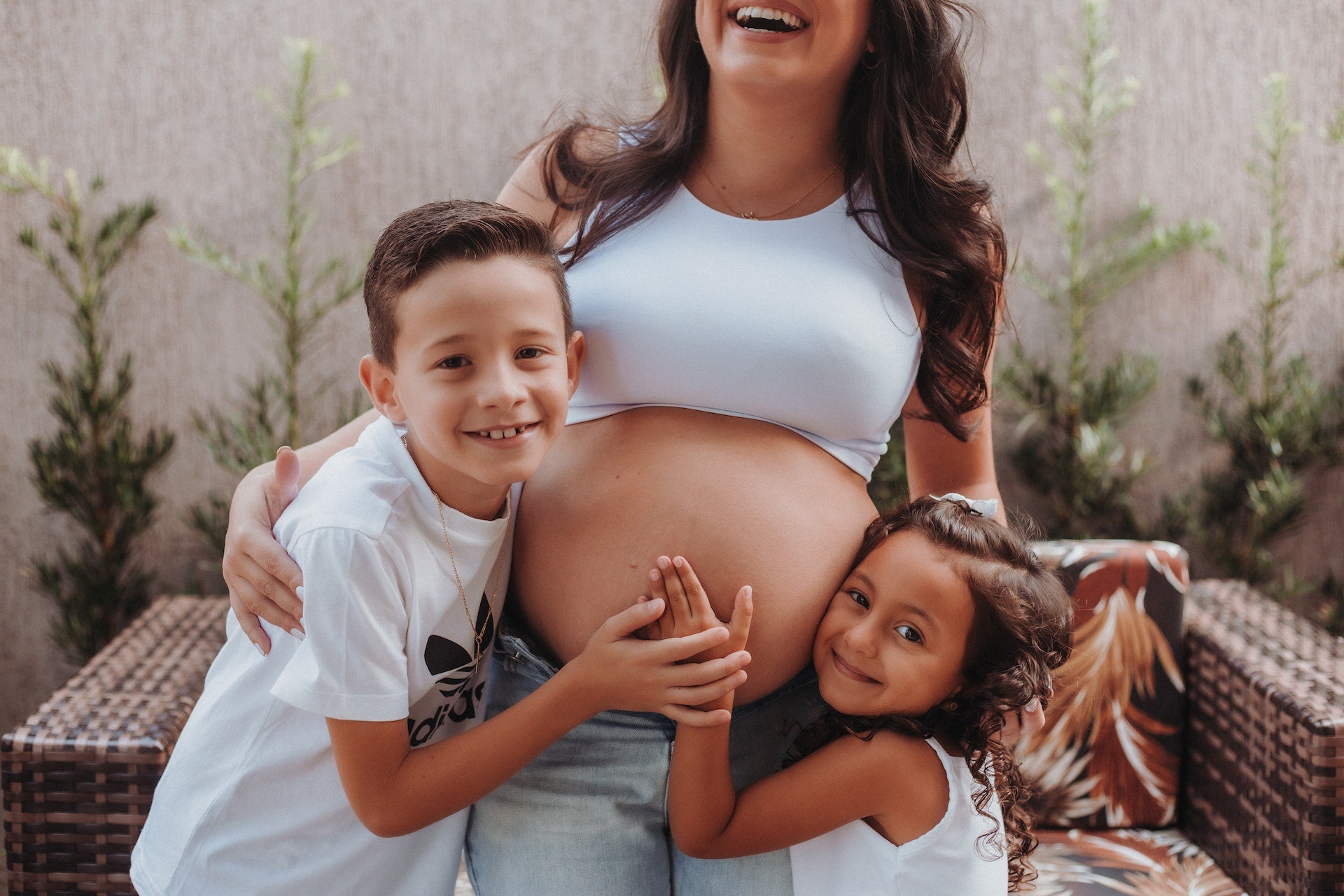 Pregnant woman with kids
