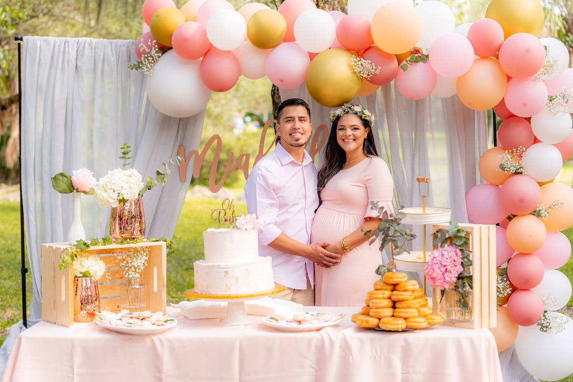 a happy couple smiling at their baby shower