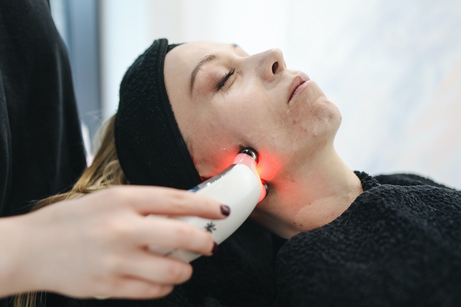 a woman receiving laser therapy