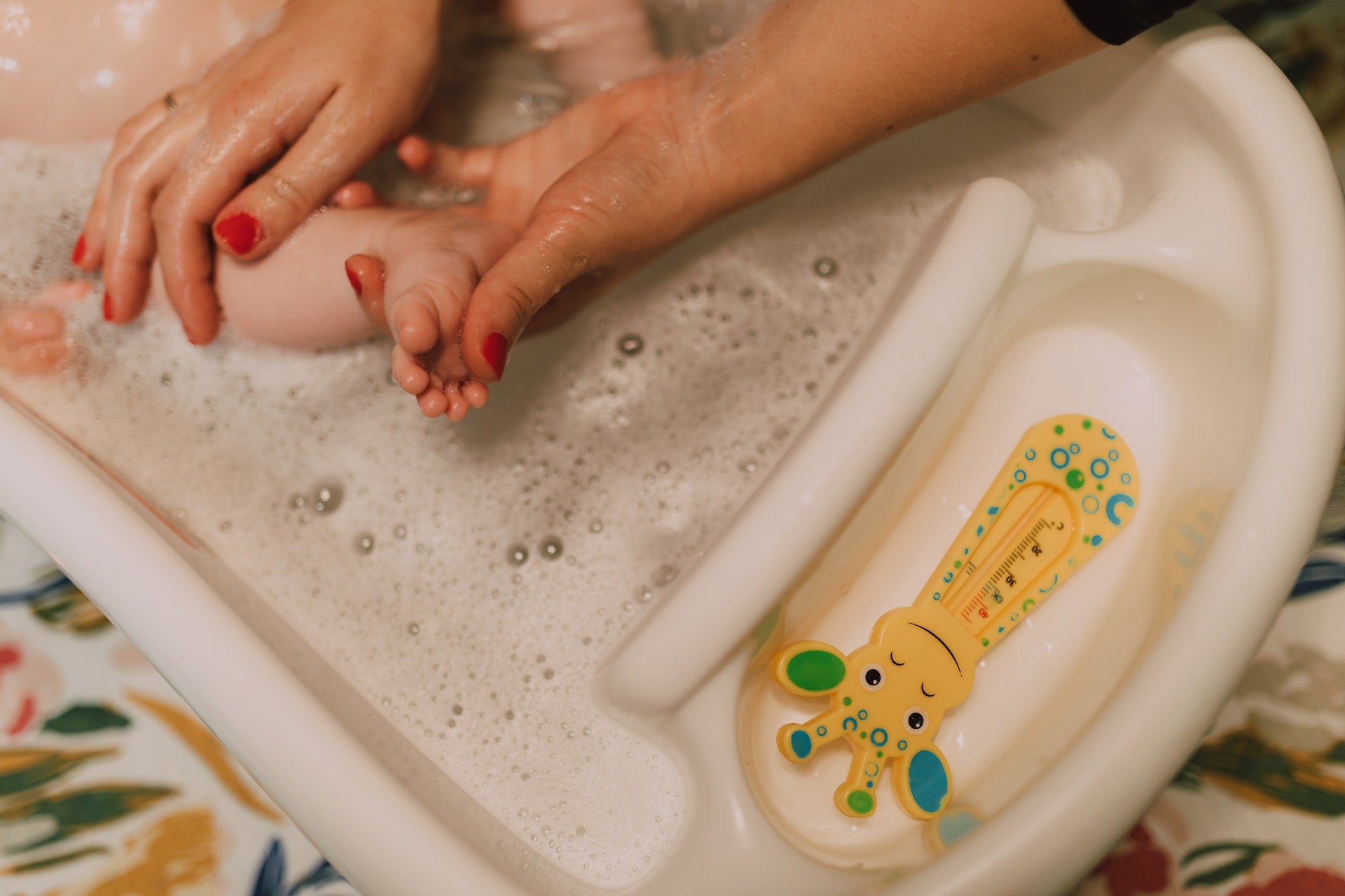 Baby feet getting bathed